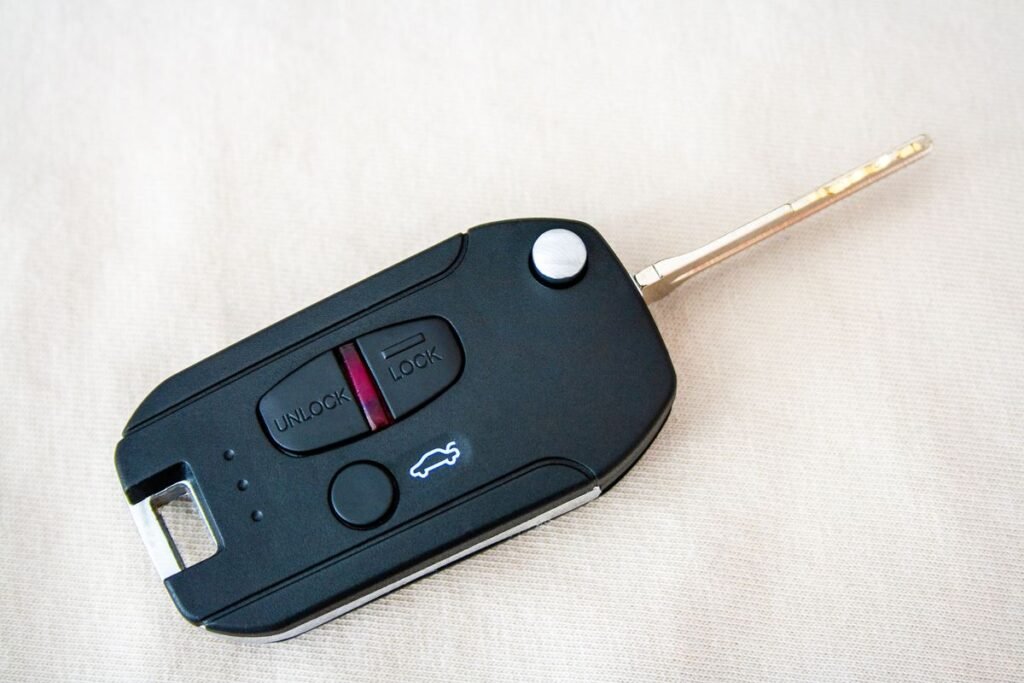 Modern car key fob with remote lock and unlock buttons