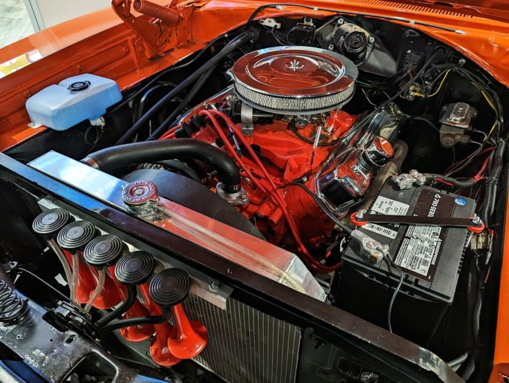 Car engine bay with cooling system components visible