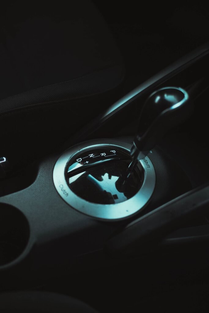 Close up of an automatic gear shifter in a car interior
