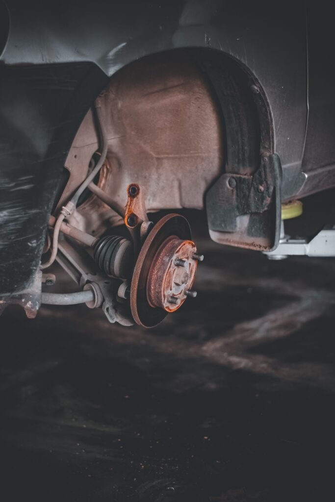 Close up of a rusty car brake system that needs repair